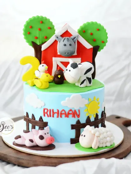 Old MacDonald had a farm, and it was a delicious cake. This farm-themed cake is perfect for a toddler's birthday, with cute, edible farm animals, a big red barn, and lots of charming details.