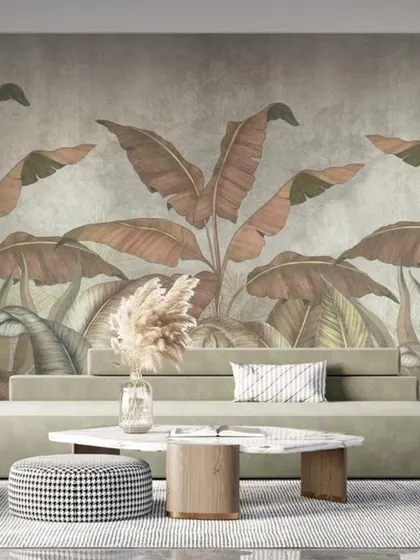 This wallpaper features oversized banana leaves in muted, earthy tones. The design provides a subtle yet impactful tropical feel, adding a touch of organic texture to a modern interior.