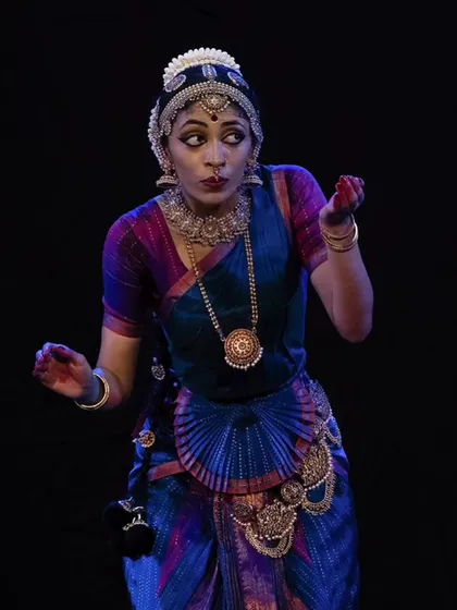 A playful and dramatic expression, as if caught in the act of some mischief. This highlights the storytelling aspect of my dance.