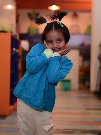 A young guest with a cute hairstyle posing for the camera. Every child gets to feel like a star.