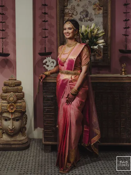 A duplicate of image 216, a graceful portrait of the bride in a traditional setting.