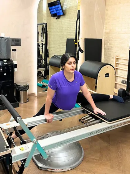 A safe and effective side split on the Reformer for our prenatal client, helping to maintain hip mobility and flexibility.