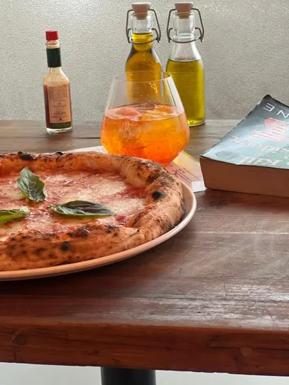 A quiet moment with a Margherita, an Aperol Spritz, and a good book.