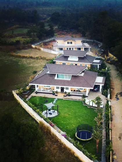 This aerial view captures the scale of a residential development we landscaped. Our planning ensures that each villa enjoys its own private green space, including a lawn, poolside planting, and boundary gardens, creating a cohesive and green community.