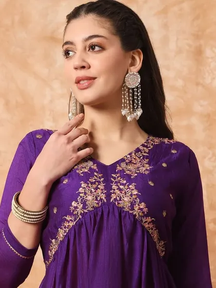 A wine-colored kurta pant set with a flattering A-line silhouette. The thread embroidery on the yoke adds a beautiful detail.