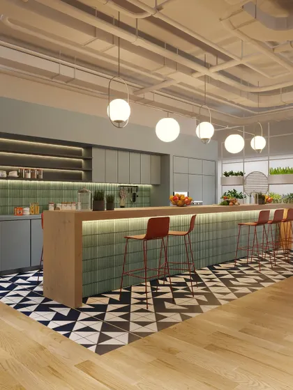 A different angle of the pantry, showing the ample counter space and stylish globe pendant lights. It’s a perfect spot for grabbing a coffee and catching up with colleagues.