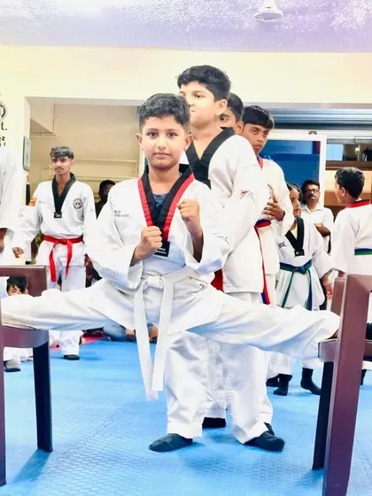 Another student holding a perfect chair split.