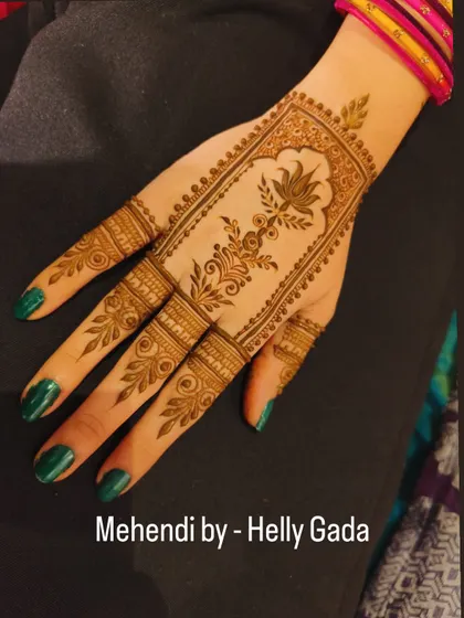 This elegant back-hand design features a rectangular panel with a beautiful lotus vine inside. The detailed finger work complements the central panel, creating a very balanced and sophisticated look.