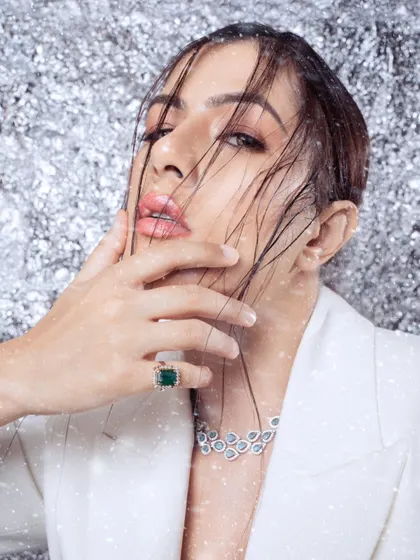 A beauty-focused shot with a wintery, high-fashion concept. The wet-look hair and glistening details create a memorable and artistic image.