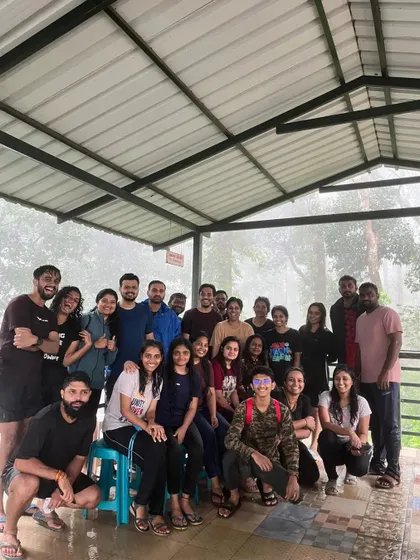 A happy group photo at the homestay, sharing stories after a day of trekking.