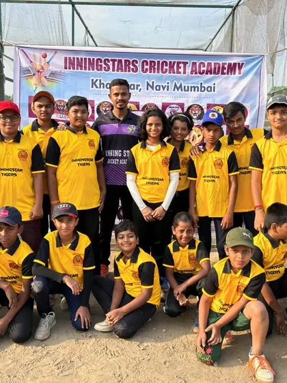 Our team in yellow jerseys posing together during the Inningstar Anniversary Match Day.