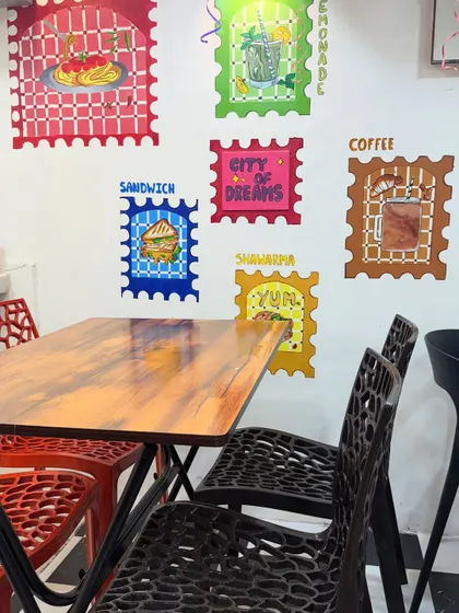 The interior of my new Thane outlet, featuring colourful wall art and comfortable seating. I'm now serving across 6 locations.