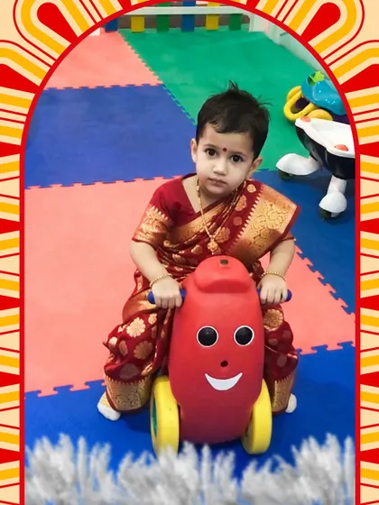 Another adorable photo from our Pujo celebrations, with a toddler enjoying a ride in our special zone for the little ones.