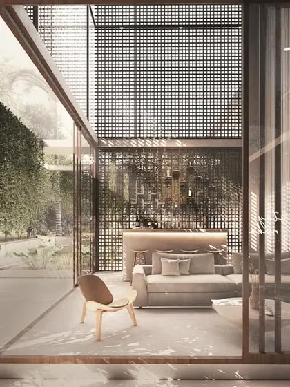 In the House of Veils, even entertainment spaces are connected to the outdoors. This bar area is defined by filtered screens and large glass panels that look out onto a verdant, private garden.