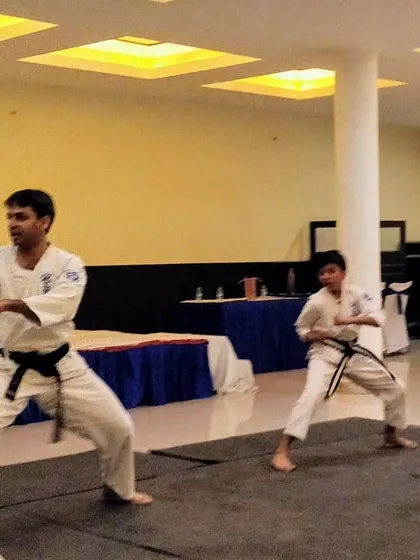 Karate is for everyone, regardless of age. Here, Senpai Manish and Senpai Jash, both 1st Dan Black Belts, demonstrate that the journey of learning is lifelong.