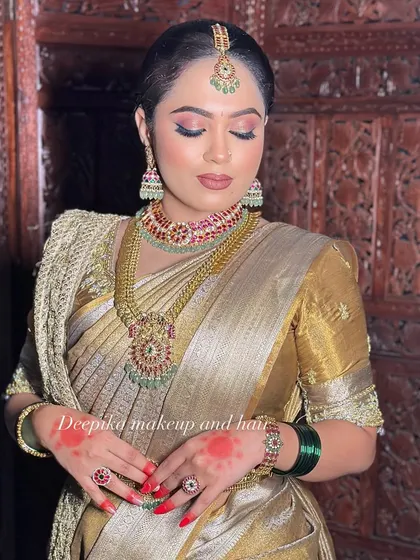 A close-up showcasing the detailed eye makeup and perfectly coordinated jewelry for a classic South Indian bridal look.