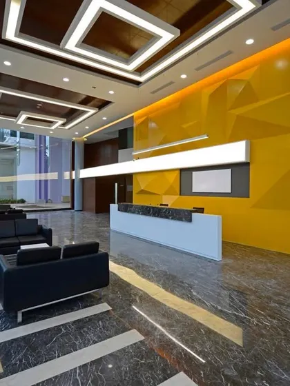 Another angle of the expansive corporate lobby, highlighting the interplay of light, reflection, and texture. The design is intended to feel spacious, modern, and impactful.