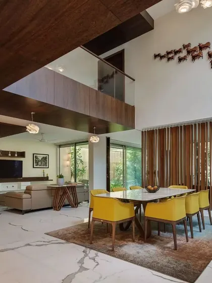 An alternate view of the open-plan living and dining area in Kanasu, showing the spaciousness and connection between different functional zones.
