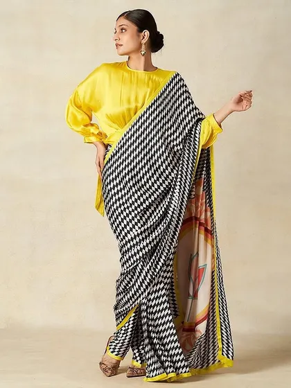 Another look from the Gulabo by Abu Sandeep shoot. The makeup remains consistent with a focus on elegant, defined features that work beautifully with the modern, graphic saree.