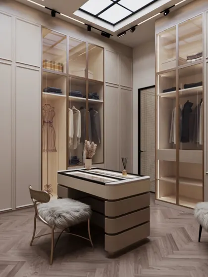A walk-in wardrobe should feel like a personal boutique. I designed this space with soft beige tones and a central accessory island to feel warm and expansive. A faux skylight overhead floods the room with a natural, diffused glow, making the daily ritual of getting dressed feel like an airy and inviting indulgence.