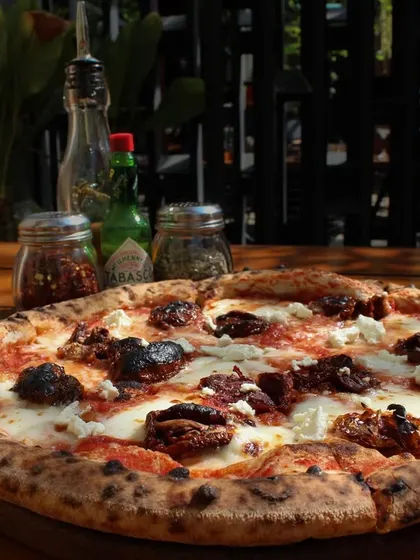Another angle of the Smokey Marzano, showing the texture of the sourdough crust and the generous toppings. It's a perfect pizza for a weekend treat.