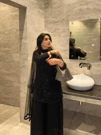 Adjusting the dupatta of my favorite black ethnic outfit.