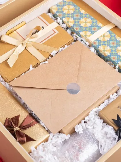 A close-up of the top layer of the Dream11 hamper. Each item is individually wrapped and arranged to create a sense of discovery and delight.