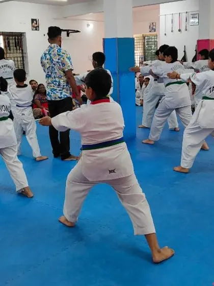 A view from the back of the class, showing their synchronized movements.