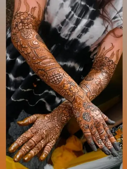 A full view of a beautiful bridal mehndi design. The patterns are a mix of traditional and modern, creating a unique and personalized look for the bride.