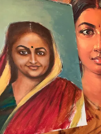 Another look at the acrylic portrait in progress. Holding the student's work against the inspiration shows the process of learning and interpretation that we foster in our classes.