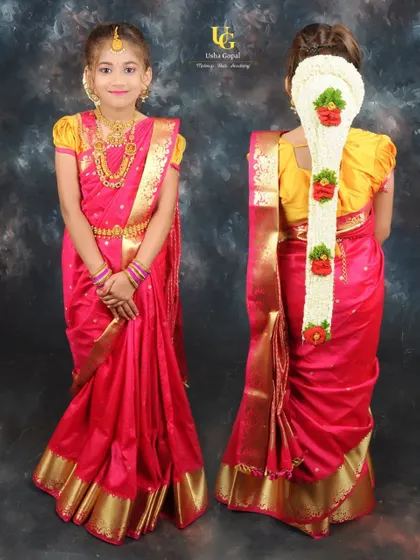 A full look at this little princess's traditional outfit. The front view shows her beautiful saree drape and jewelry, while the back view highlights her long floral braid (jadai).