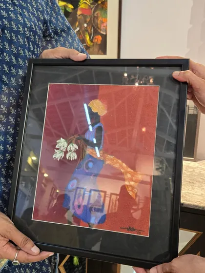 A framed artwork by artist Nikitha is sold at our "Vernissage" exhibition. We are thrilled to support our artists and connect them with new collectors.