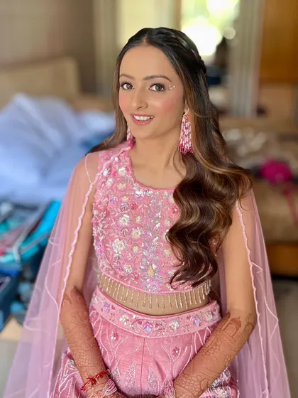 The final look, featuring a soft pink monochromatic style with pearl accents. It's a dreamy and romantic look, perfect for a haldi or a themed party.