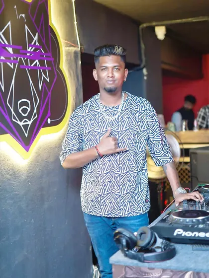 A quick pose behind the decks. I'm always ready for the camera while keeping the music going.