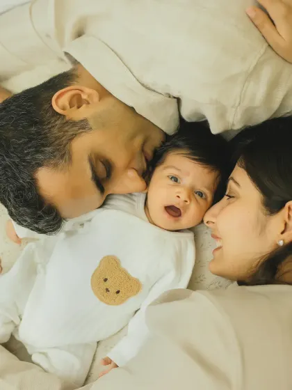 That look of surprise and wonder on a newborn's face is just priceless. A beautiful, candid moment between a new family.