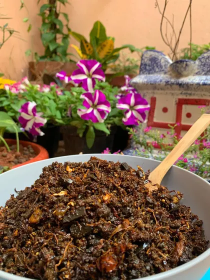 A bowl of my Aneshi and smoked meat pickle, ready to be served. I love having this with a simple plate of rice and dal.