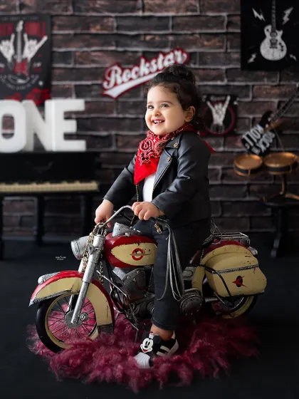 Vroom vroom! This birthday boy is having a blast on his miniature motorcycle.
