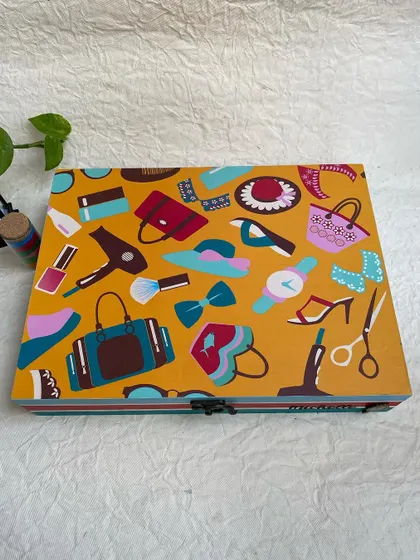 This angle shows the clean lines and colorful stripes I painted on the sides of the wooden box to complement the lid design.