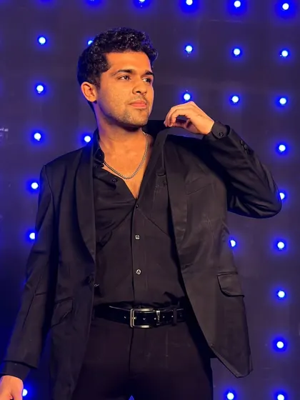 Sharp in black. A classic look against a cool blue-lit background.