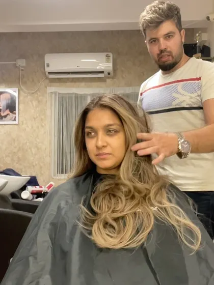 Me with a client after her beautiful blonde transformation.