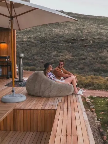 This deck is designed for relaxation and enjoying the view. It shows how even in a remote location, you can have a comfortable and stylish outdoor living area.