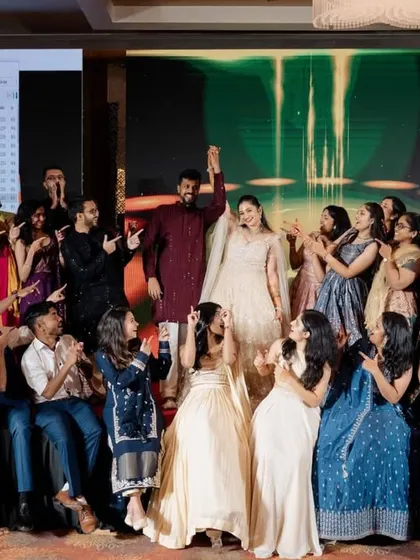 A fantastic group photo with the couple and their entire high-energy friend group. This is the result of a successful Sangeet where everyone felt involved.