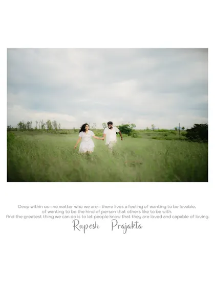 A beautiful wide shot of the couple running through a field, capturing a feeling of freedom and happiness.
