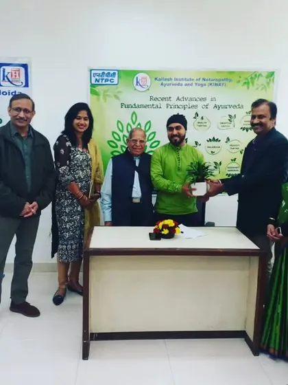 Receiving a plant as a token of gratitude at the NTPC camp. It symbolizes the growth and wellness we aim to cultivate.