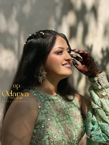 A happy, smiling bride enjoying her Haldi day. The makeup is waterproof and long-lasting to ensure she looks flawless throughout the event.