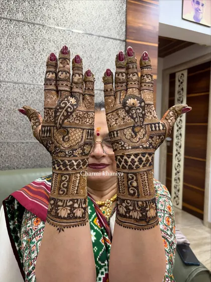 A classic full-hand mehendi with peacock motifs and traditional patterns. Perfect for anyone in the wedding party who wants a rich, detailed look.