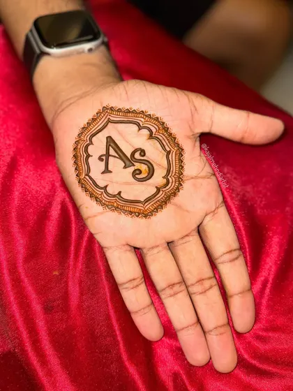 Another look at a simple and modern groom's henna. The 'AS' initial design is a popular choice for grooms who want something meaningful but not overly elaborate.