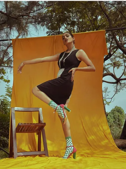 A playful, high-energy pose from the 'ELINOR' shoot.