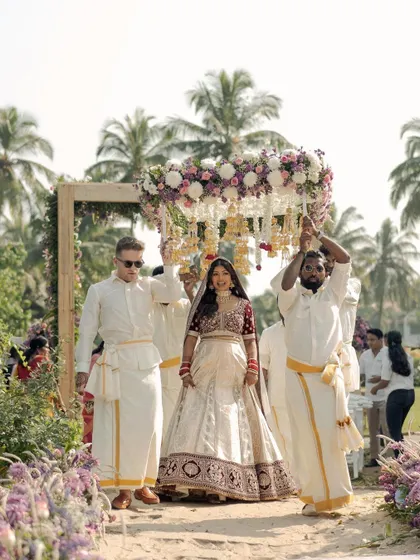 The grand bridal entry. Kavi looks absolutely regal under the phoolon ki chadar, her makeup glowing in the daylight.