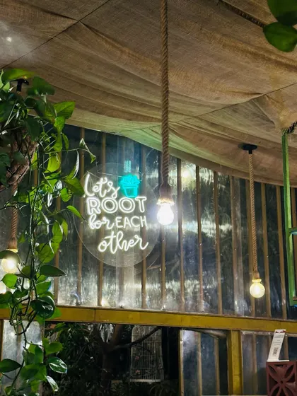 "Let's root for each other." One of our neon signs that captures the community spirit we foster here. It’s a little reminder to spread positivity.
